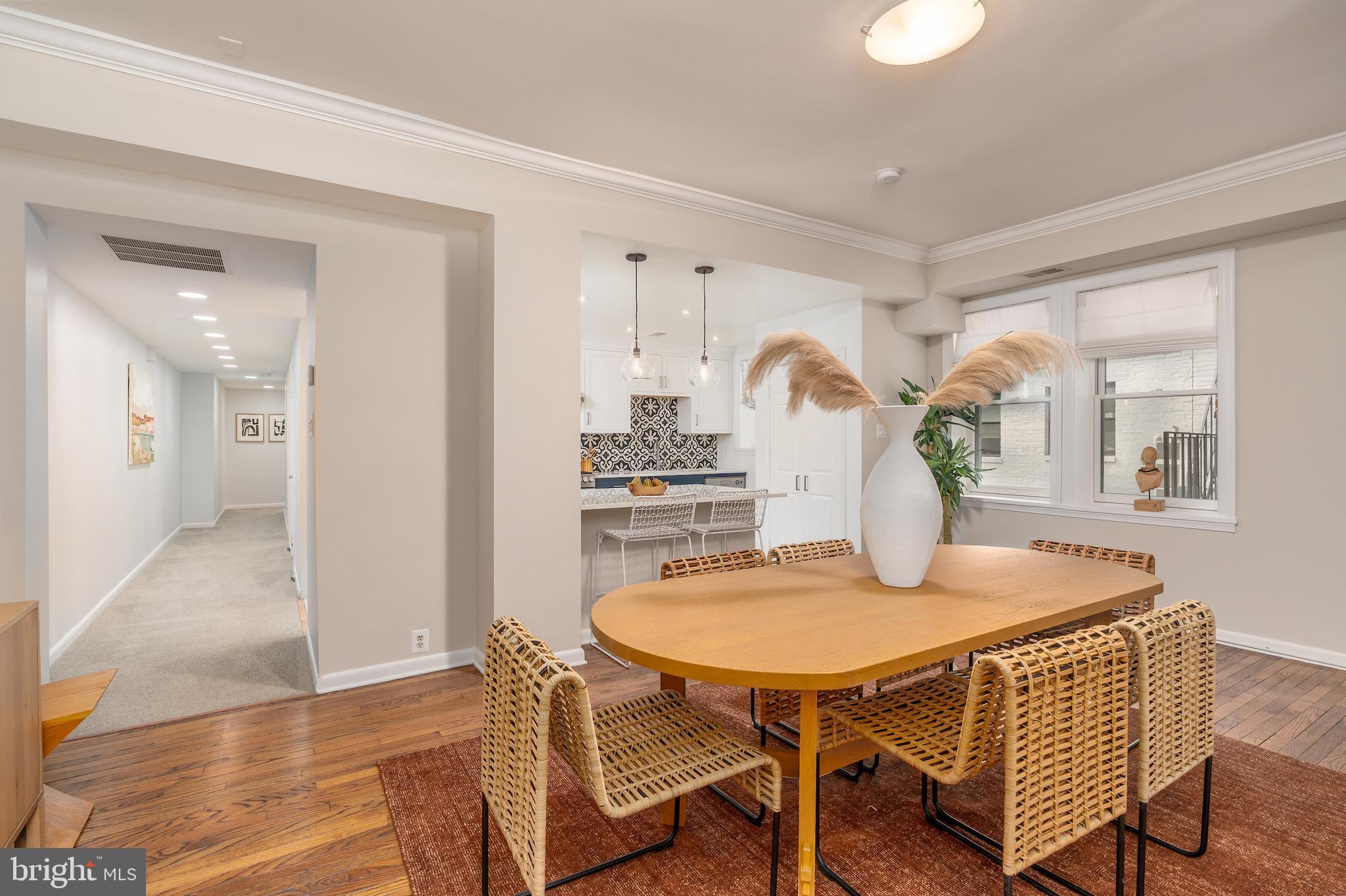 2230 California Street Northwest, Unit 3BE Washington, DC 20008 - Photo 21 of 49 a dining room with furniture and wooden floor