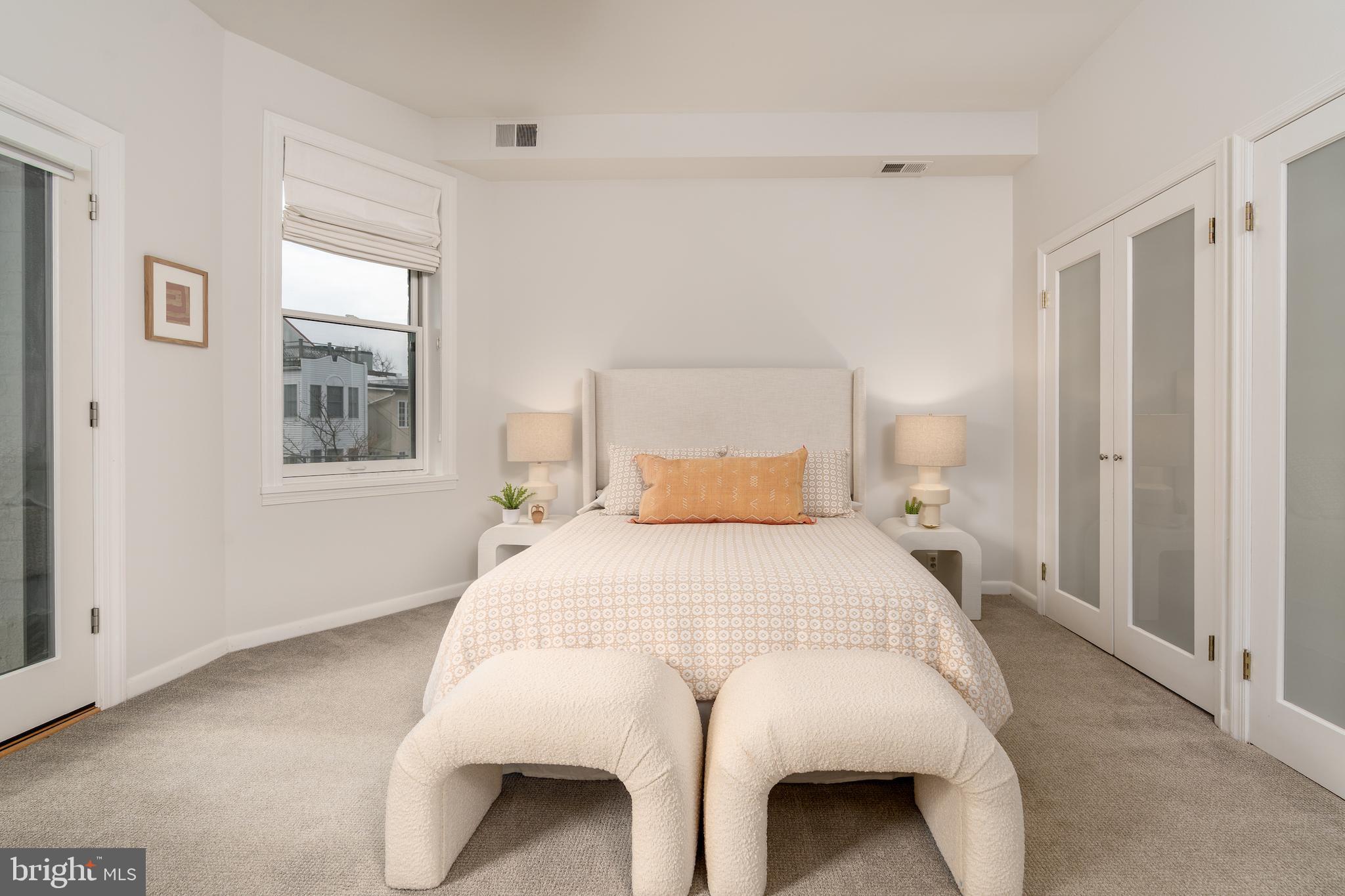 2230 California Street Northwest, Unit 3BE Washington, DC 20008 - Photo 28 of 49 a bedroom with a bed and a window