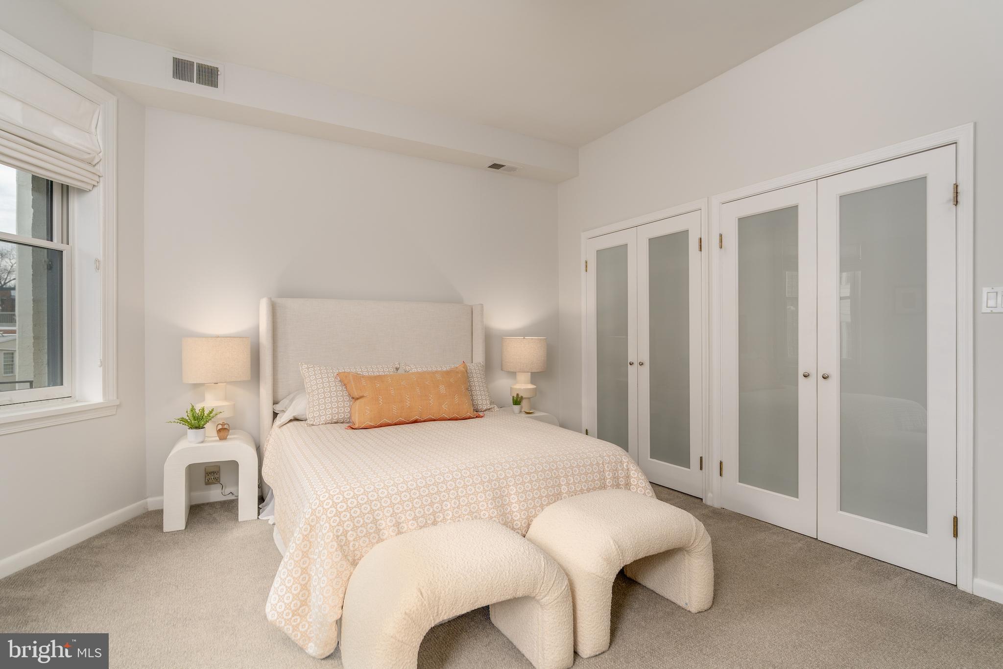 2230 California Street Northwest, Unit 3BE Washington, DC 20008 - Photo 30 of 49 a bedroom with a bed and chair