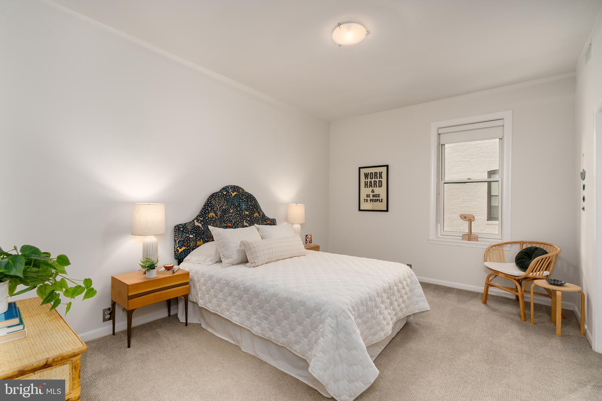 2230 California Street Northwest, Unit 3BE Washington, DC 20008 - Photo 39 of 49 a bedroom with a bed and a chair