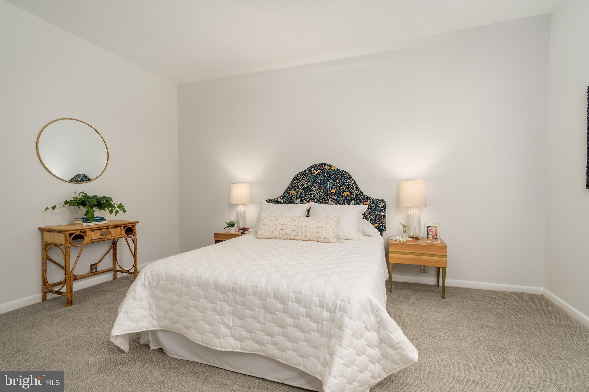 2230 California Street Northwest, Unit 3BE Washington, DC 20008 - Photo 40 of 49 a bedroom with a bed a table and chair