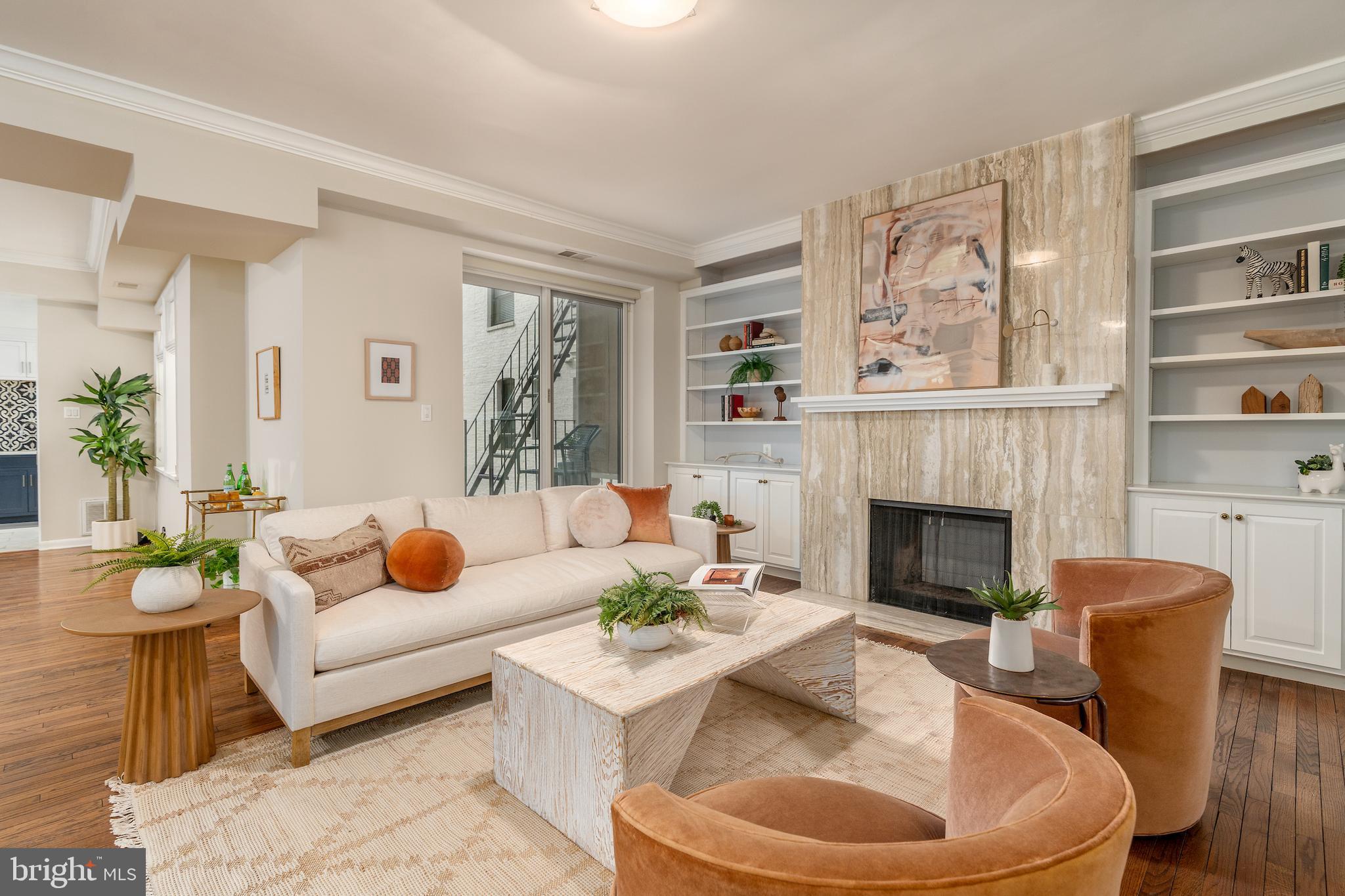 2230 California Street Northwest, Unit 3BE Washington, DC 20008 - Photo 5 of 49 a living room with furniture and a fireplace