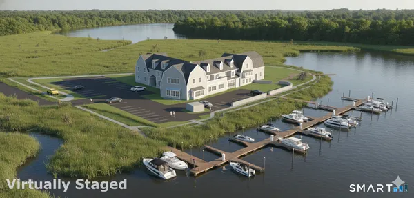 an aerial view of a house with swimming pool and lake view