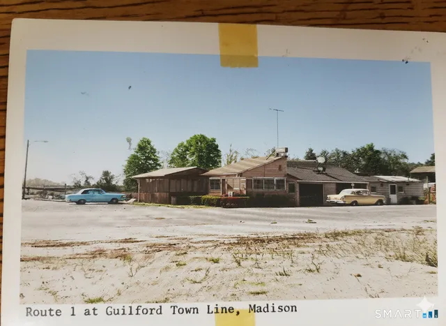 a view of a lake with lawn chairs