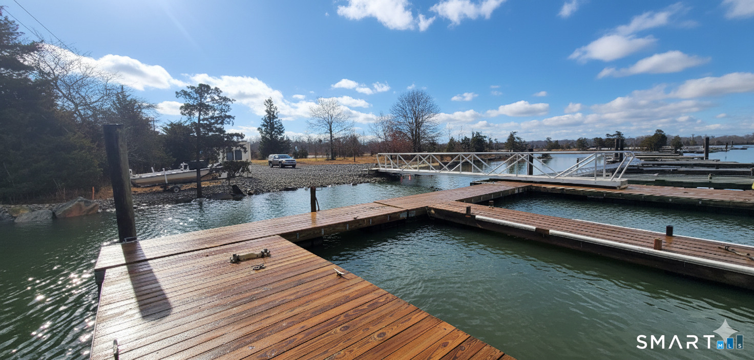 4 Boston Post Road Madison, CT 06443 - Photo 2 of 31 a view of a swimming pool with lawn chairs