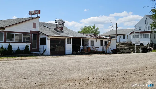a view of a lake with chairs