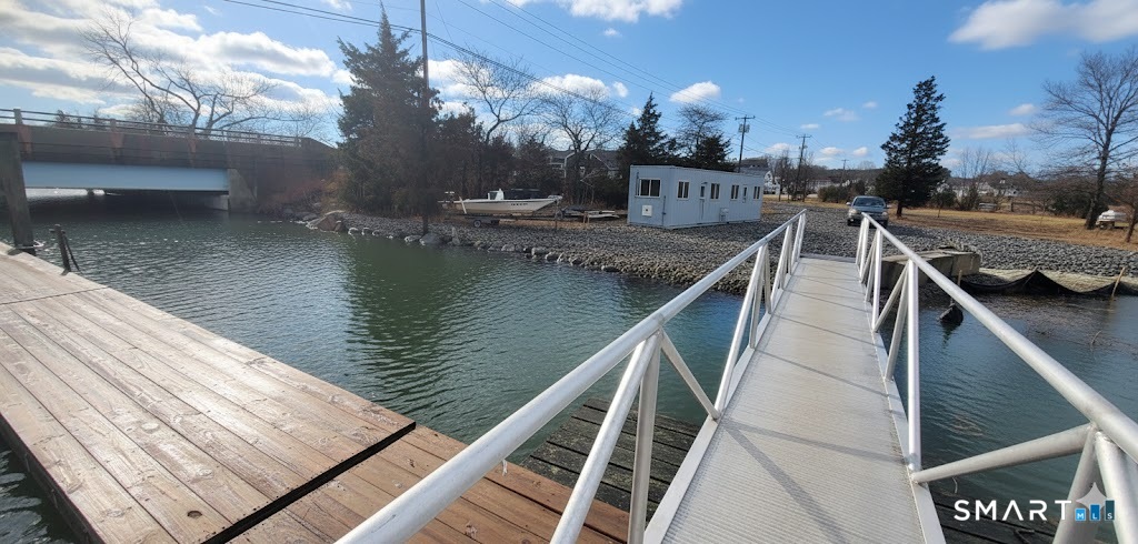 4 Boston Post Road Madison, CT 06443 - Photo 3 of 31 a view of a balcony with an outdoor seating