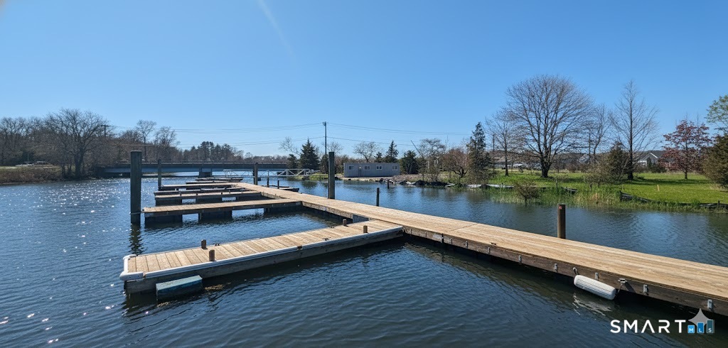 4 Boston Post Road Madison, CT 06443 - Photo 7 of 31 a view of a lake with houses