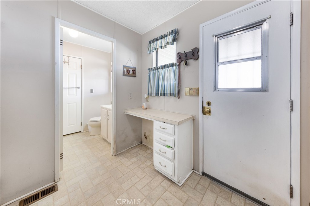602 Roadrunner Way Perris, CA 92570 - Photo 15 of 27 a bathroom with a sink a toilet and a mirror