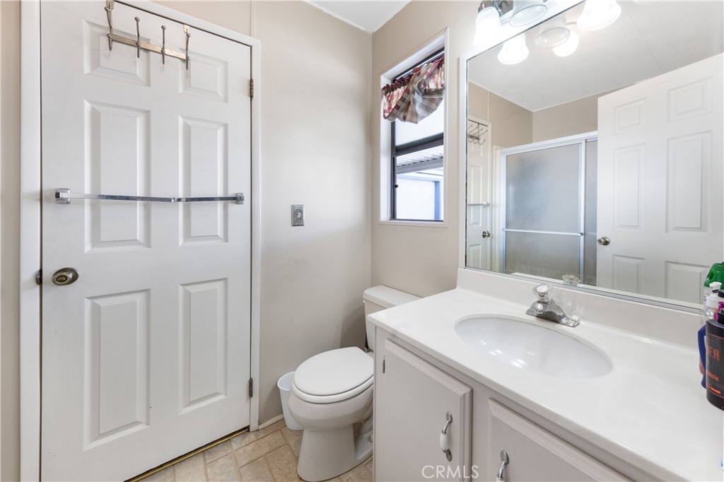 602 Roadrunner Way Perris, CA 92570 - Photo 27 of 27 a bathroom with a sink a toilet and shower