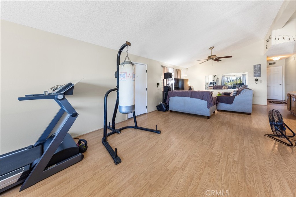 602 Roadrunner Way Perris, CA 92570 - Photo 6 of 27 a view of a room with gym equipment