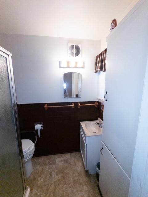 613 Laurel Road Athens, TX 75751 - Photo 13 of 13 Full bathroom featuring a white vanity with integrated sink, patterned floor tiling, and a separate shower enclosure