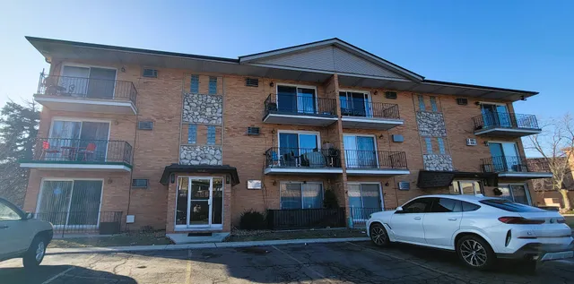 a view of a car parked in front of a building