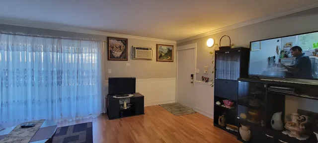 a view of a livingroom with furniture and an empty room