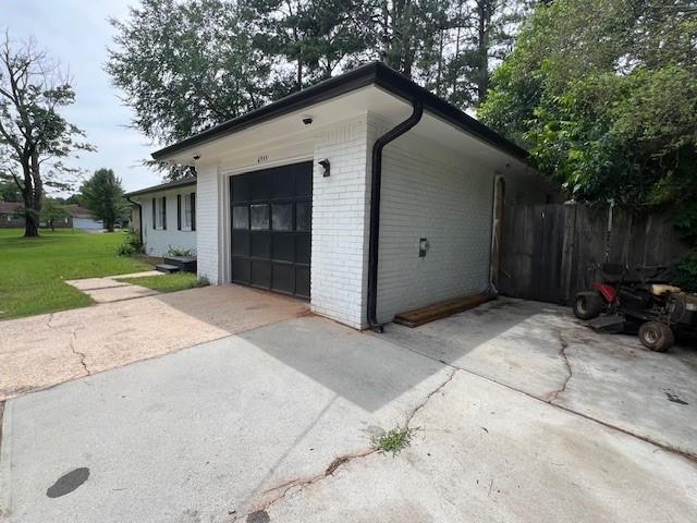 6935 Fielder Road Rex, GA 30273 - Photo 3 of 22 a backyard of a house with barbeque oven and trees