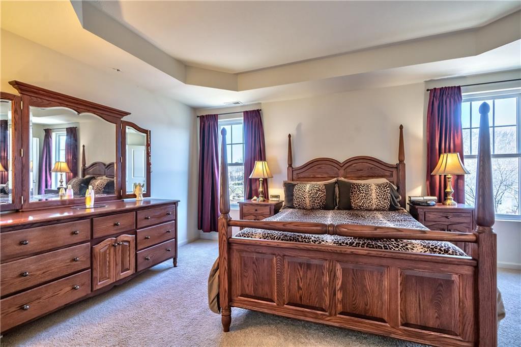 152 Harmony Road Wexford, PA 15090 - Photo 13 of 25 The large master bedroom suite adorned with a tray ceiling & walk-in closet with custom closet organizers.