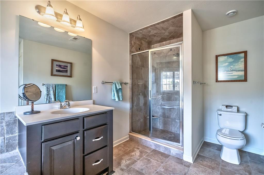 152 Harmony Road Wexford, PA 15090 - Photo 16 of 25 View of one of the vanities and the ceramic surround shower.