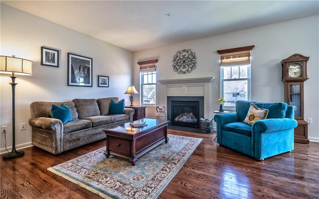 The family room is highlighted by a gas fireplace & flows into the dining room & kitchen. 