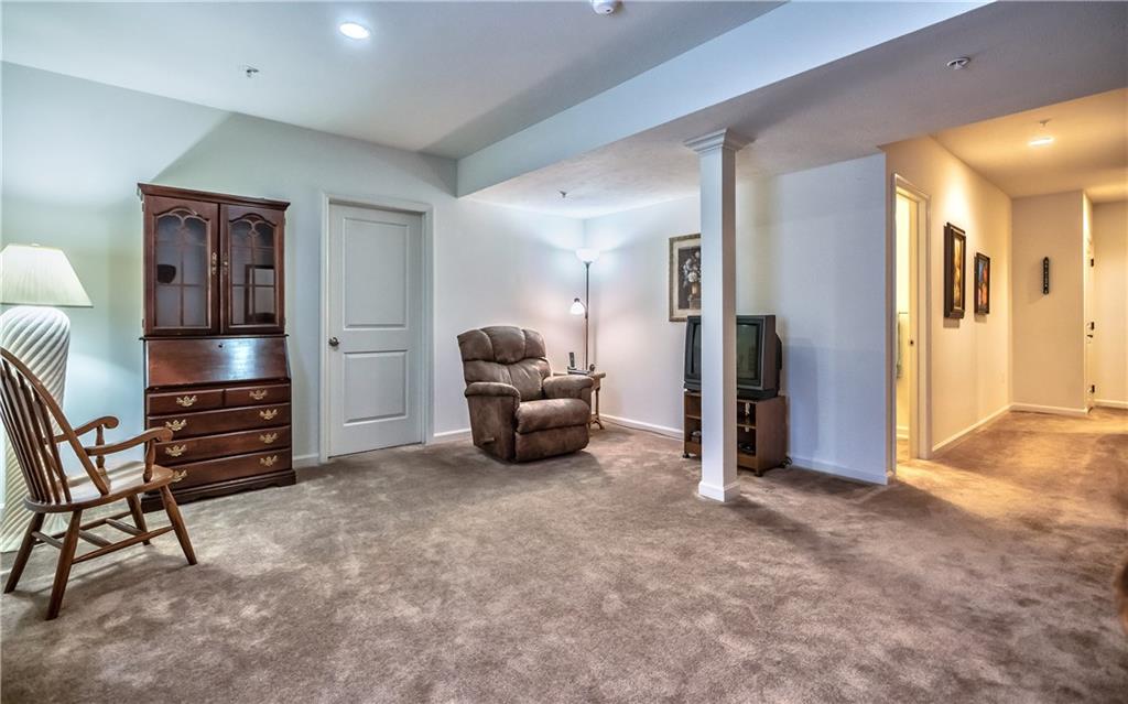 152 Harmony Road Wexford, PA 15090 - Photo 24 of 25 Another view of the game room with access to the huge storage room.