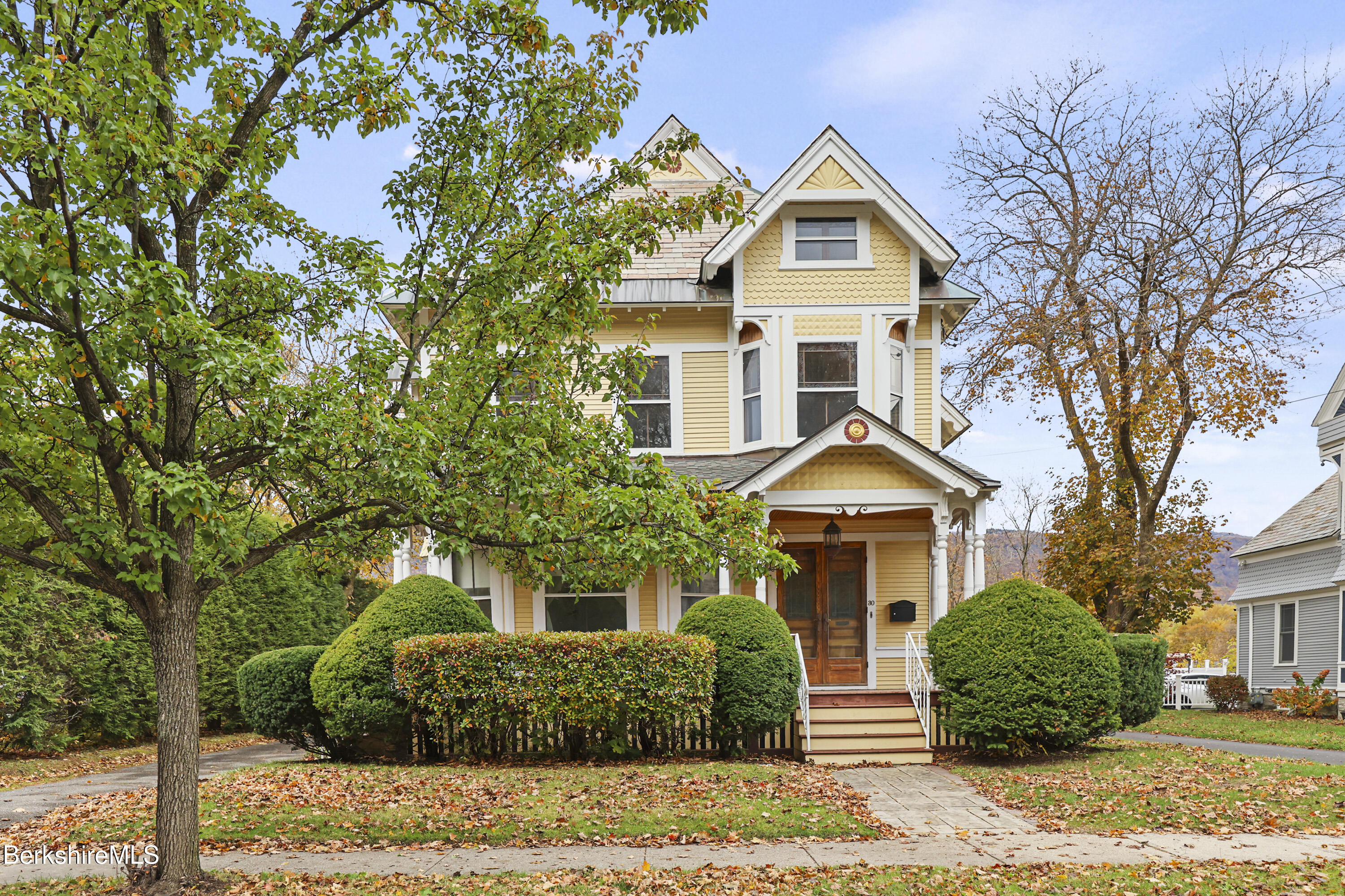 front view of a house with a yard