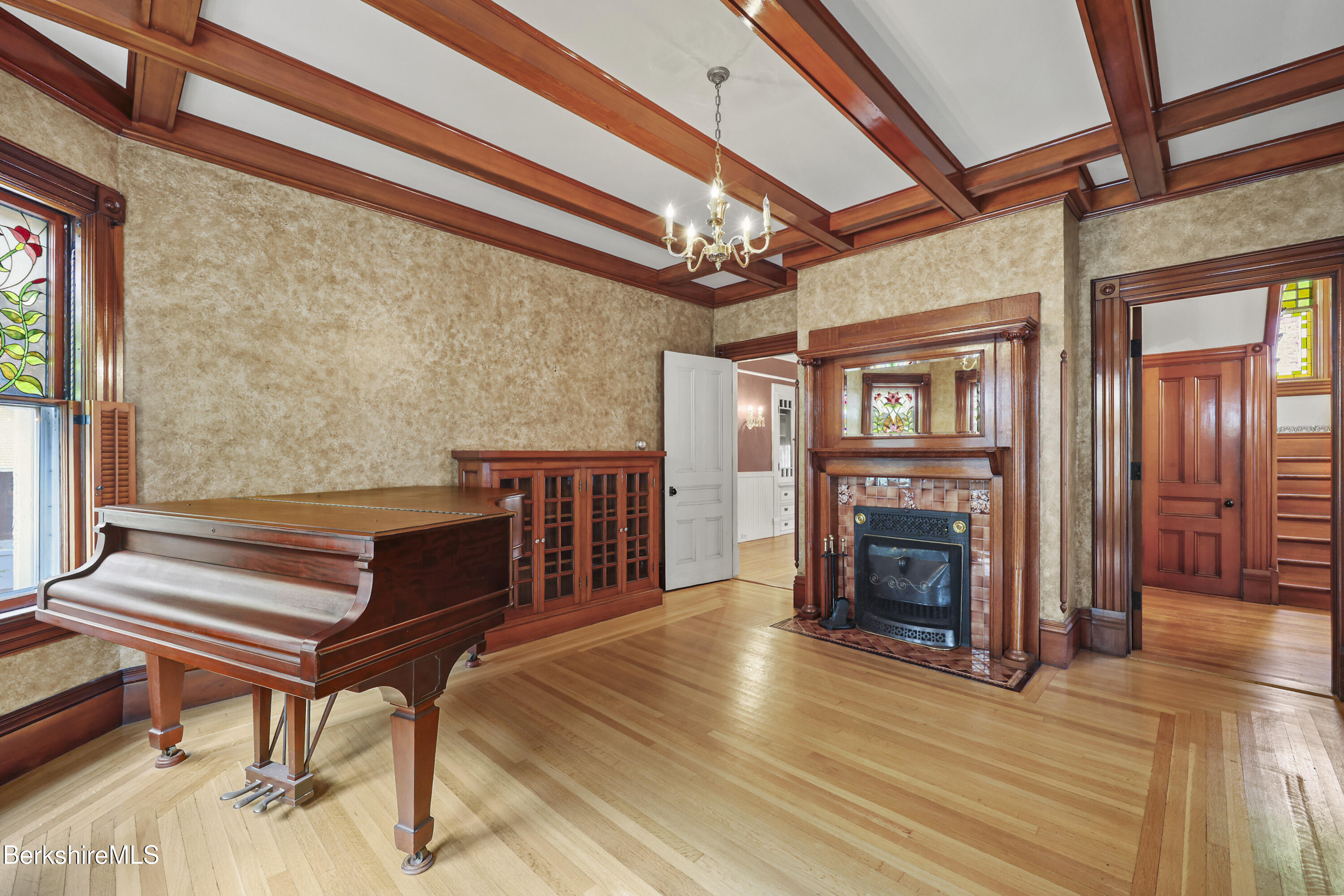 30 Summer Street Adams, MA 01220 - Photo 13 of 57 a living room with furniture a fireplace and a ceiling fan