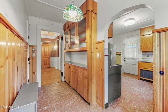 a kitchen with a stove microwave and sink