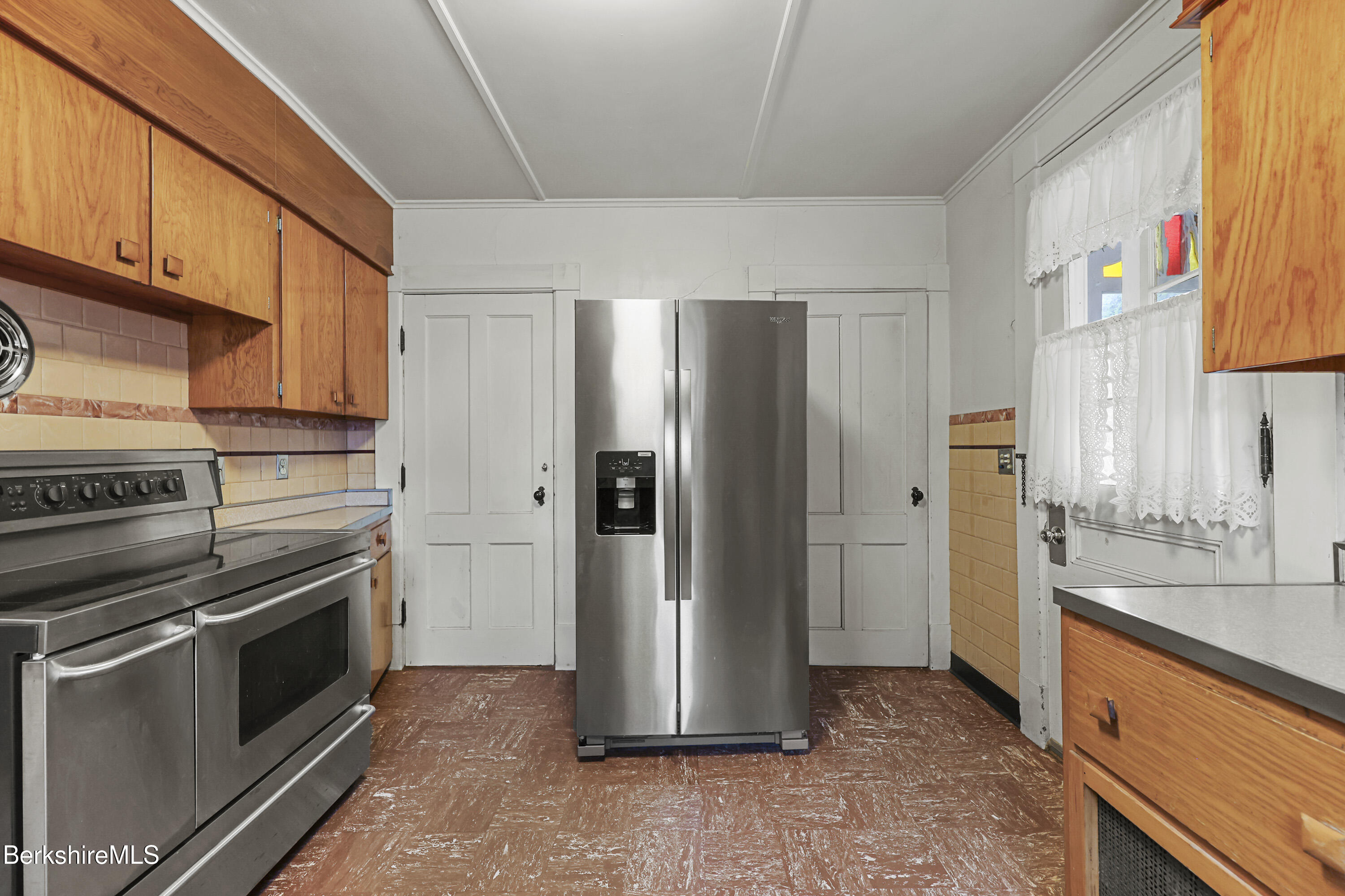 30 Summer Street Adams, MA 01220 - Photo 26 of 57 a kitchen with stainless steel appliances granite countertop a refrigerator and a stove