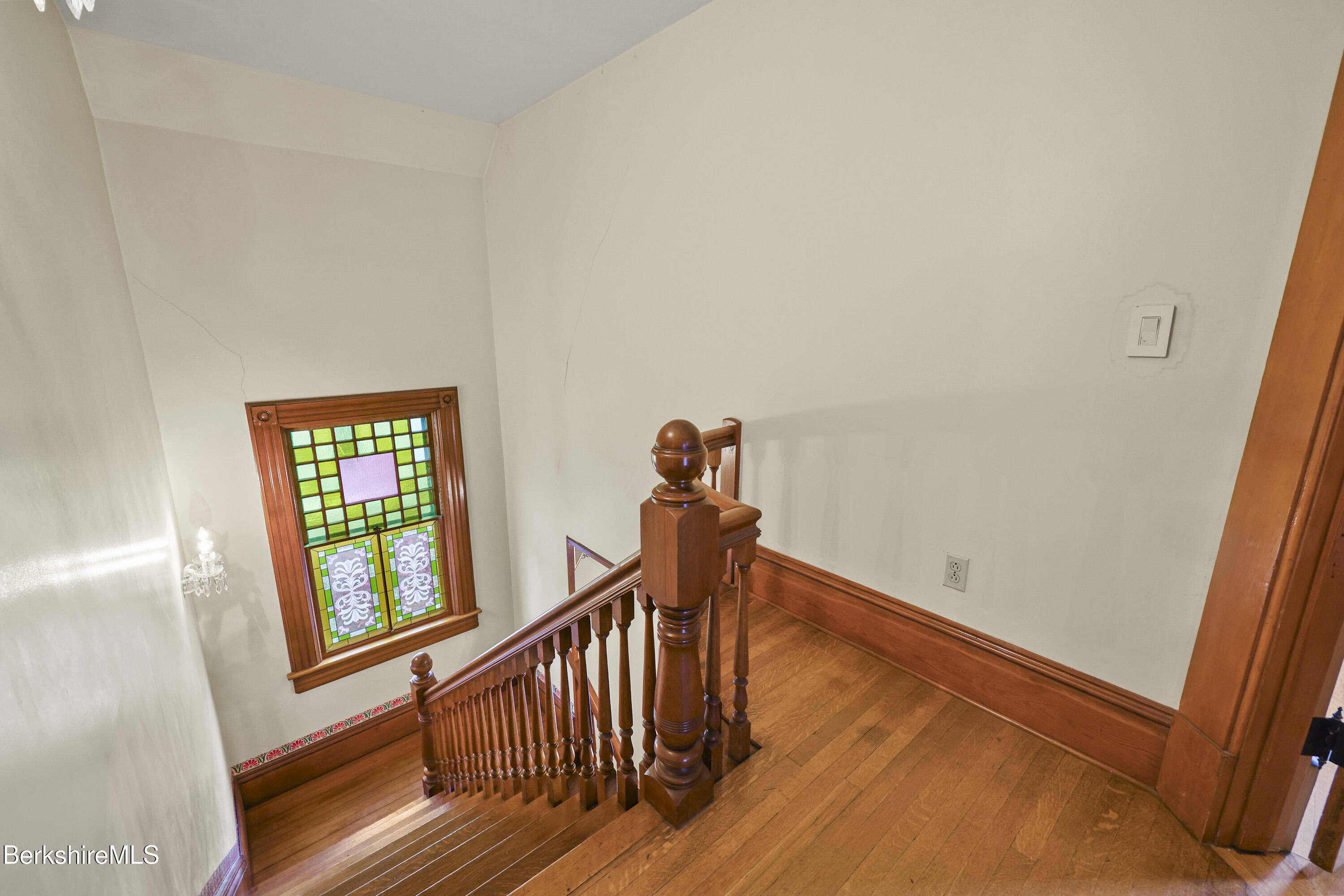 30 Summer Street Adams, MA 01220 - Photo 32 of 57 a view of a hallway with wooden floor and stairs