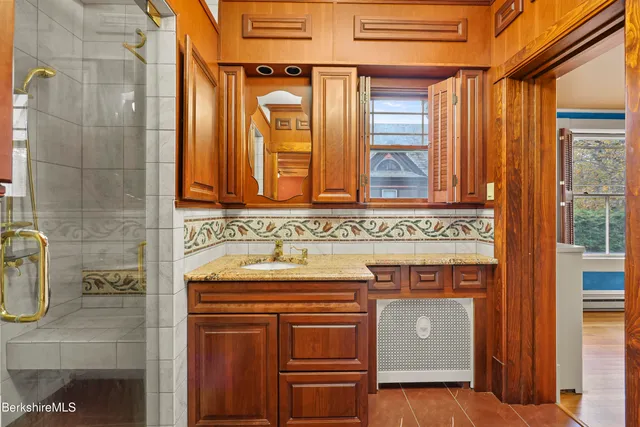 a bathroom with a sink and a mirror