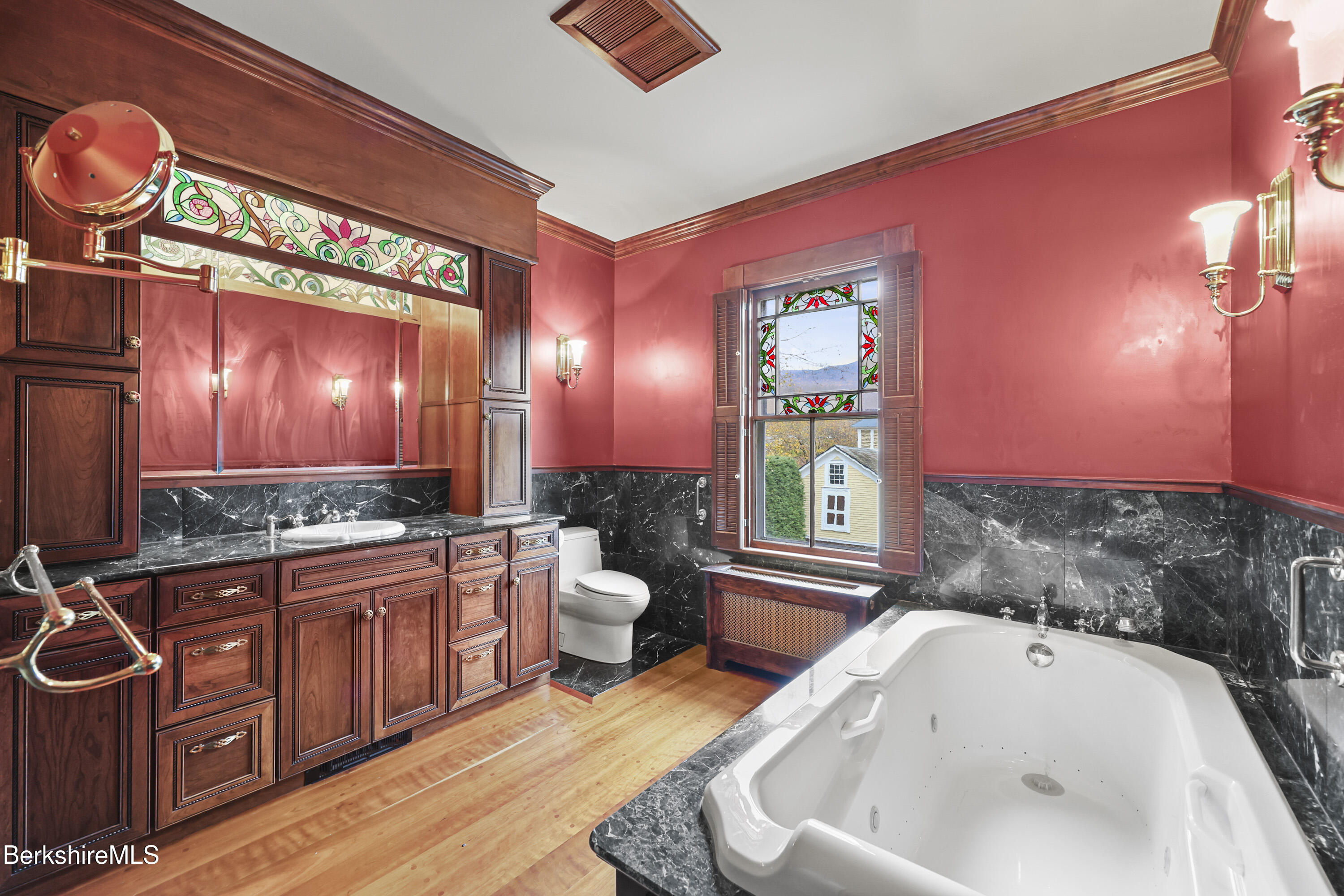 30 Summer Street Adams, MA 01220 - Photo 48 of 57 a bathroom with a tub a sink and a large mirror