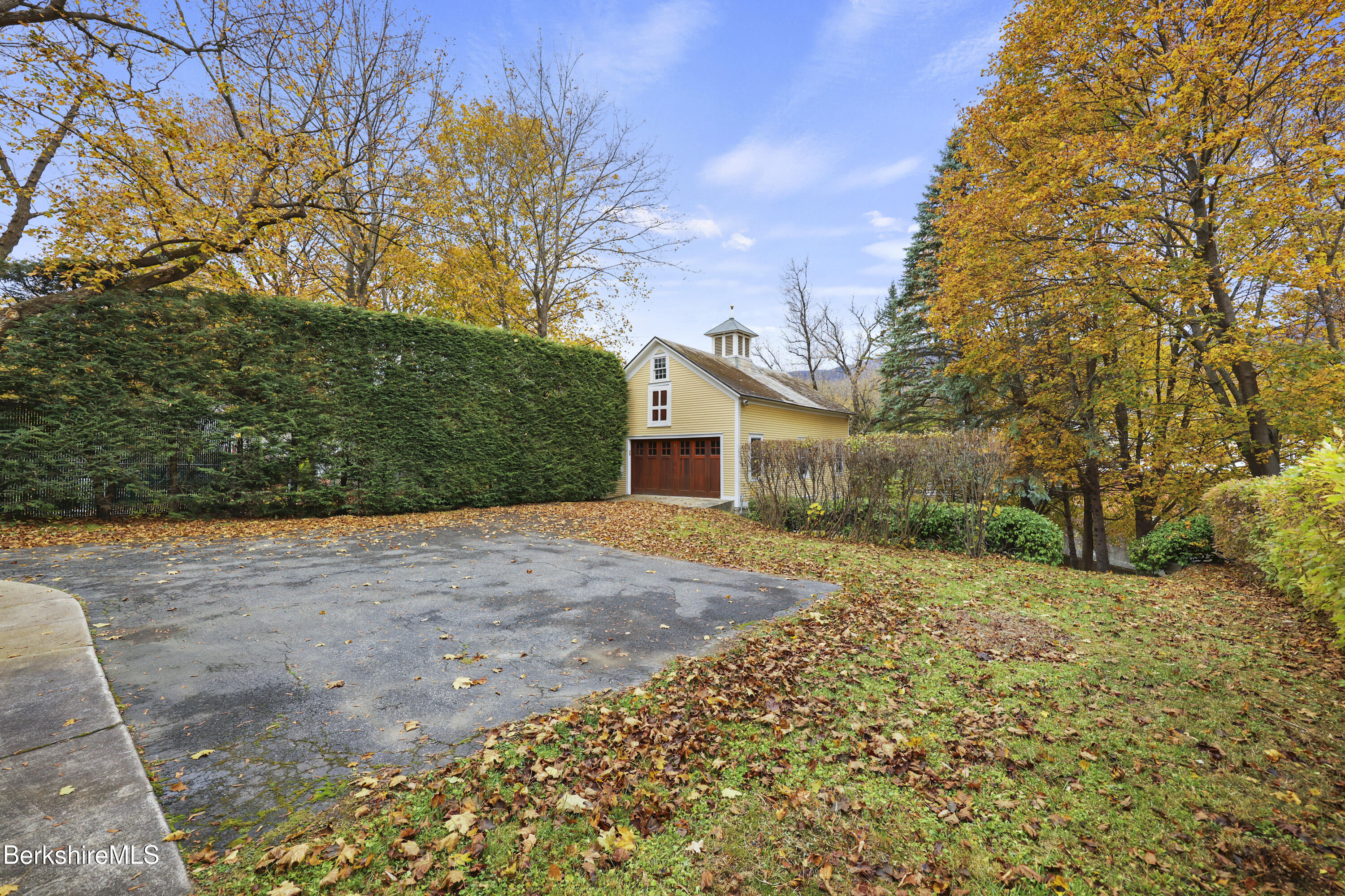30 Summer Street Adams, MA 01220 - Photo 53 of 57 a yellow house with trees in front of it