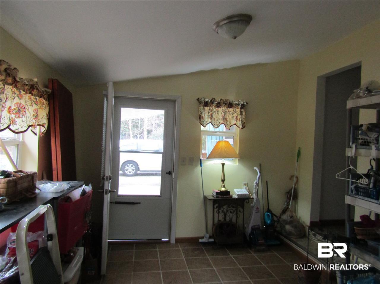 1340 Ridgewood Drive Lillian, AL 36549 - Photo 23 of 23 Door goes to Carport