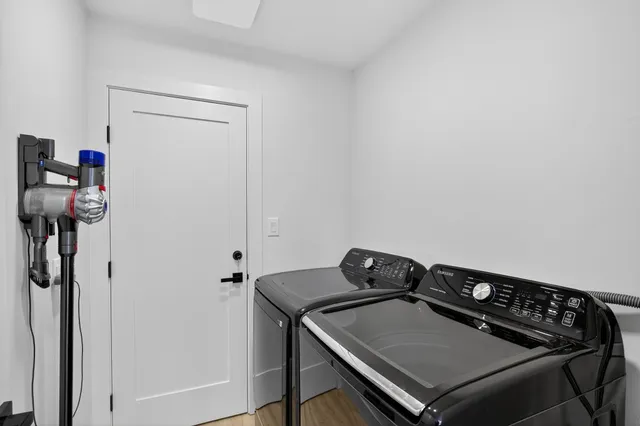 a close up of a sink a stove and a utility room