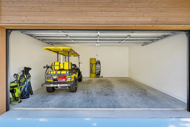 a view of a garage with a table and chairs