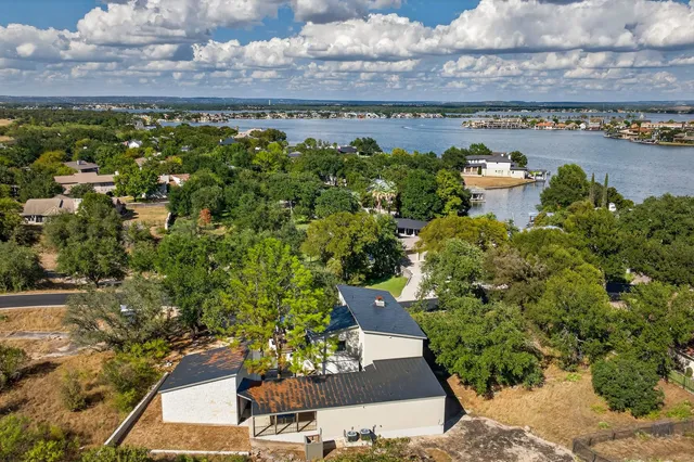 an aerial view of a building with lake view