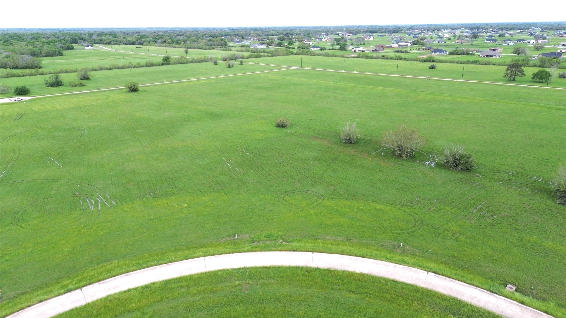 504 Brahman Trail Angleton, TX 77515 - Photo 1 of 8 a view of field with grass