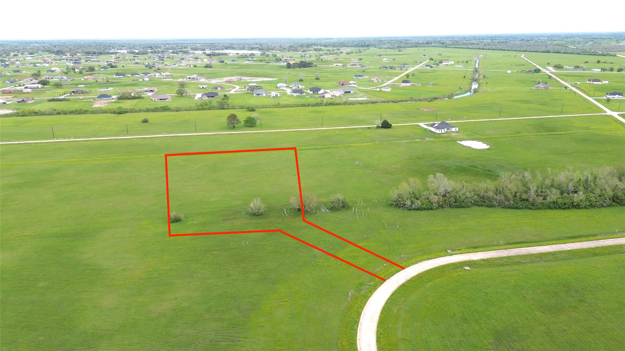 504 Brahman Trail Angleton, TX 77515 - Photo 5 of 8 a view of a field with an ocean
