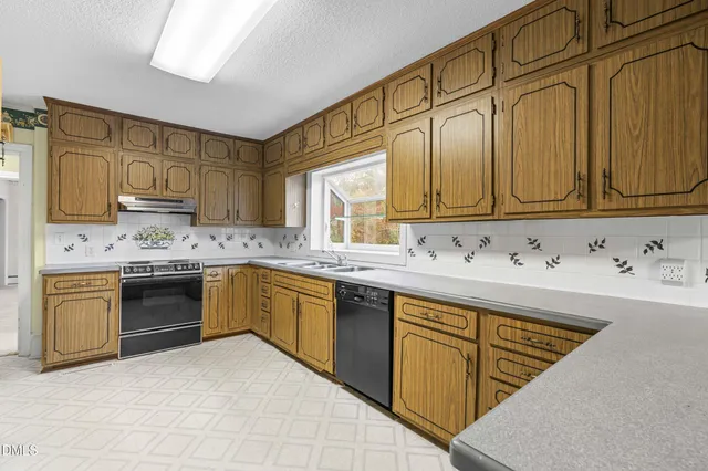 a view of a kitchen with a sink and a kitchen