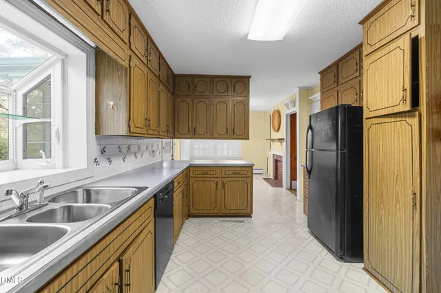 a kitchen with stainless steel appliances granite countertop a sink and cabinets