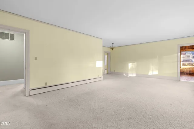 a view of a street with houses on the side