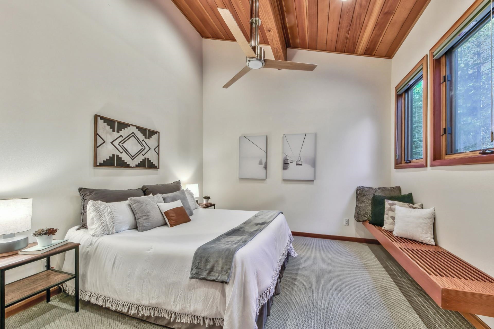 12998 Timber Ridge Road Truckee, CA 96161 - Photo 15 of 21 a bedroom with bed and a chandelier