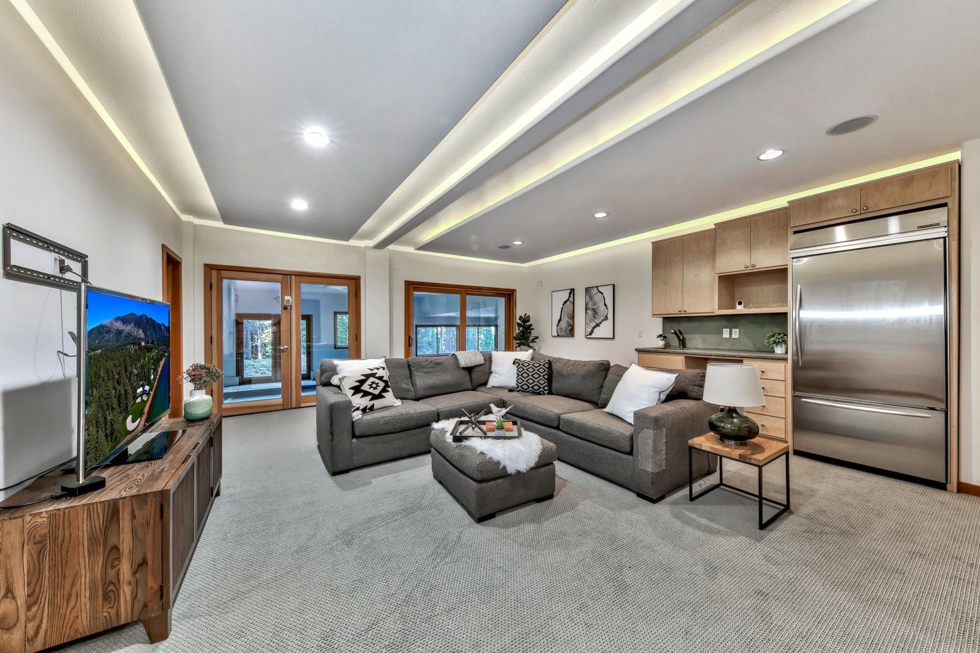 12998 Timber Ridge Road Truckee, CA 96161 - Photo 19 of 21 a living room with furniture and a flat screen tv