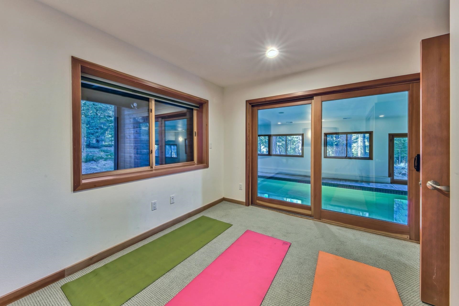 12998 Timber Ridge Road Truckee, CA 96161 - Photo 20 of 21 a living room with a bed furniture and a large window
