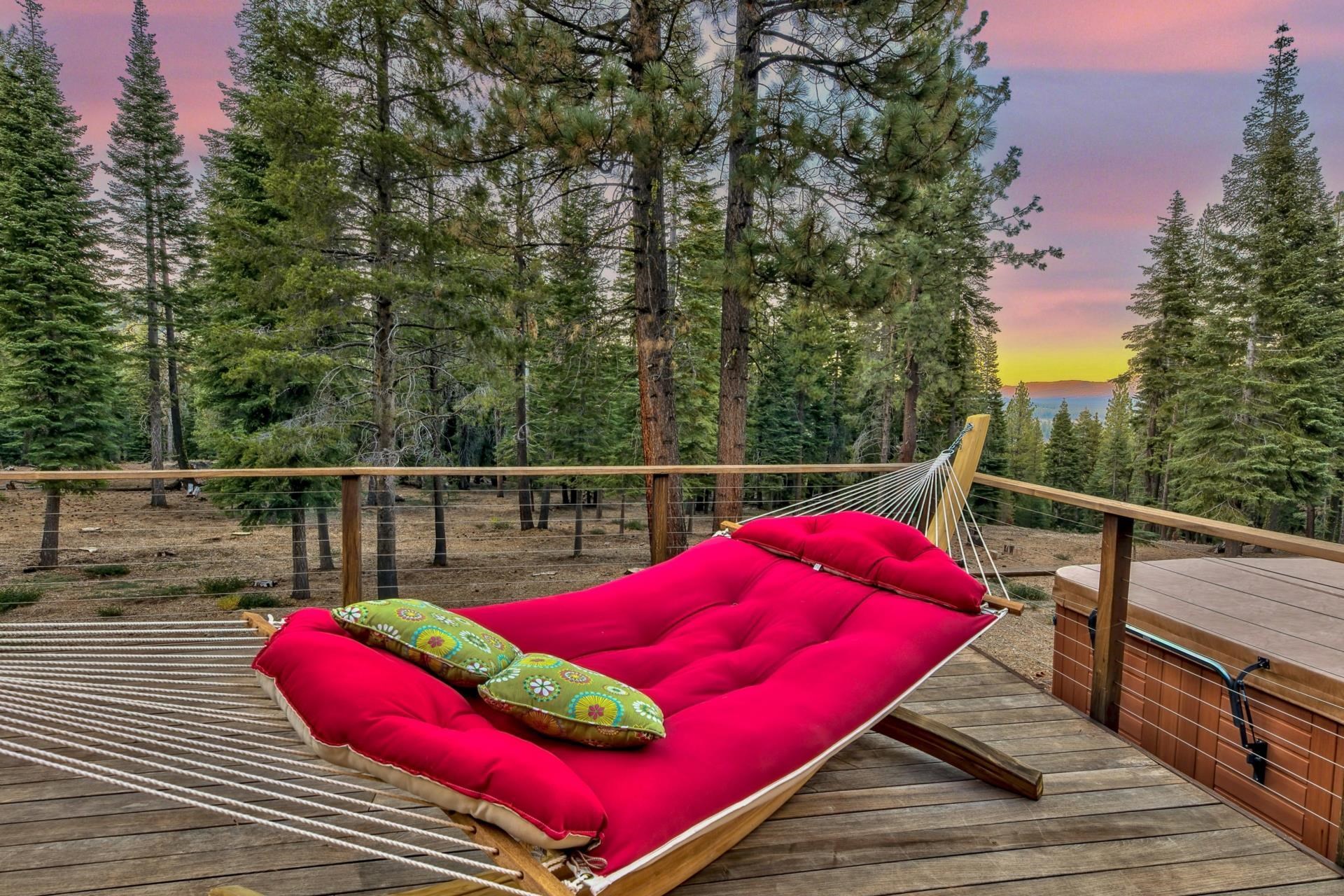 12998 Timber Ridge Road Truckee, CA 96161 - Photo 6 of 21 a view of a deck with couches chairs and wooden floor