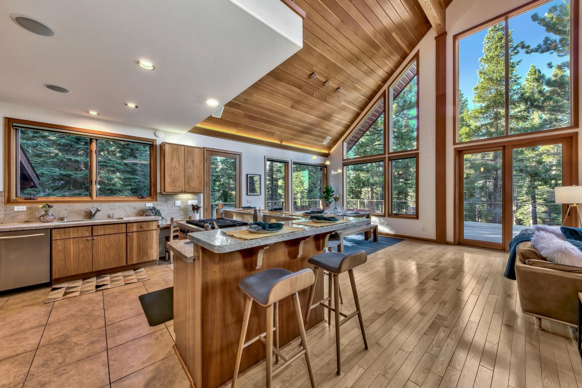 12998 Timber Ridge Road Truckee, CA 96161 - Photo 9 of 21 a kitchen with a table chairs stove and wooden floor