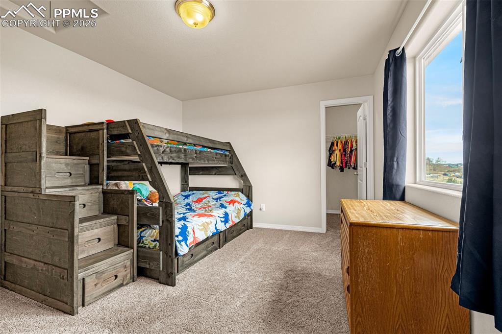 9074 Vanderwood Road Colorado Springs, CO 80908 - Photo 29 of 36 Spacious Secondary bedroom upstairs with walk in closet