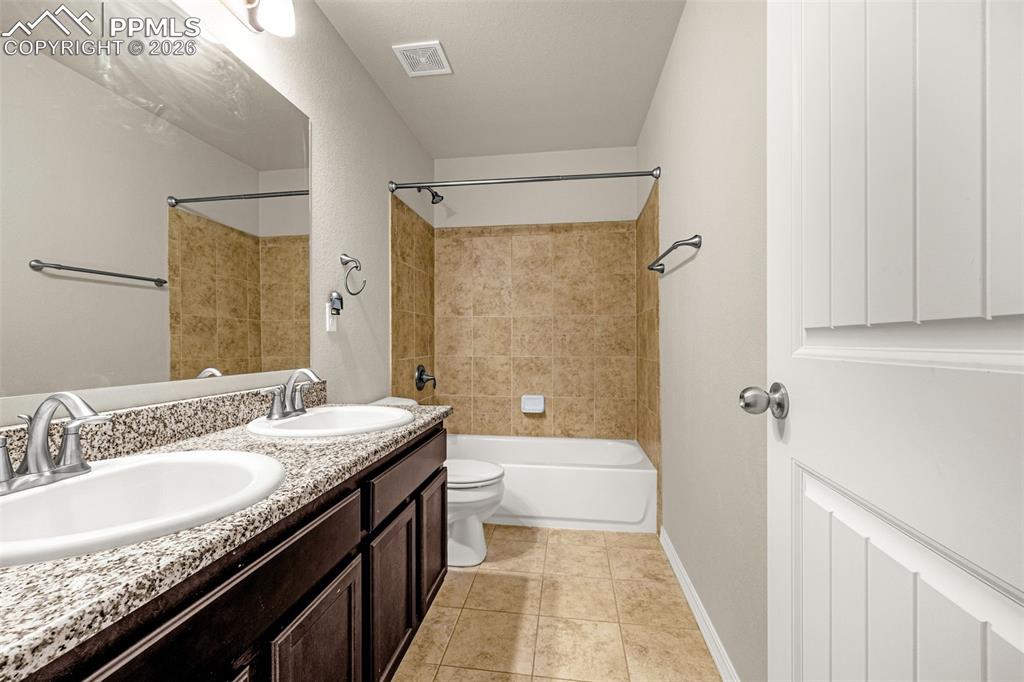 9074 Vanderwood Road Colorado Springs, CO 80908 - Photo 30 of 36 Secondary bathroom with double sinks