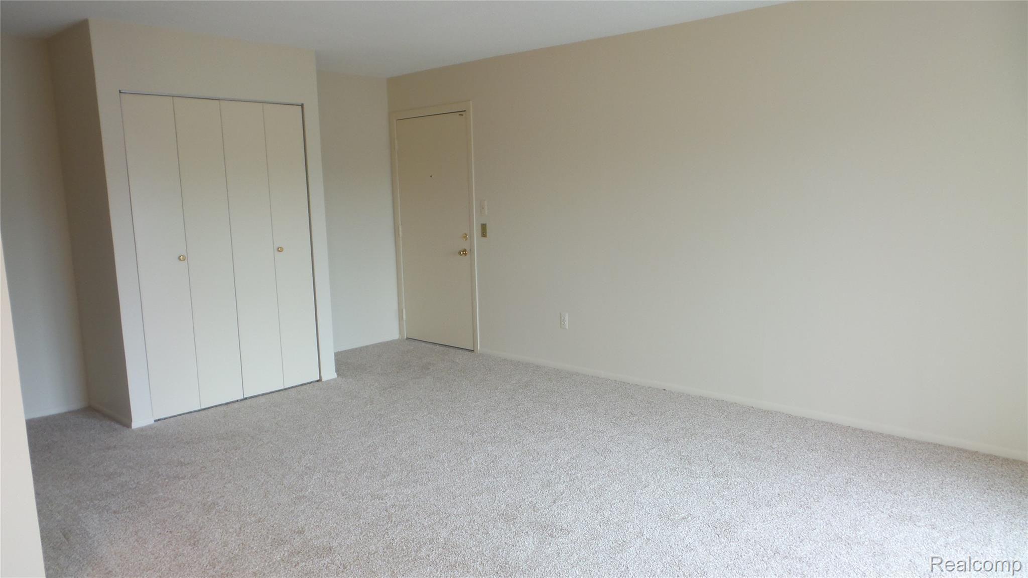 1516 Normandy Road, Unit 201 Royal Oak, MI 48073 - Photo 6 of 22 Living Room View with spacious Closet