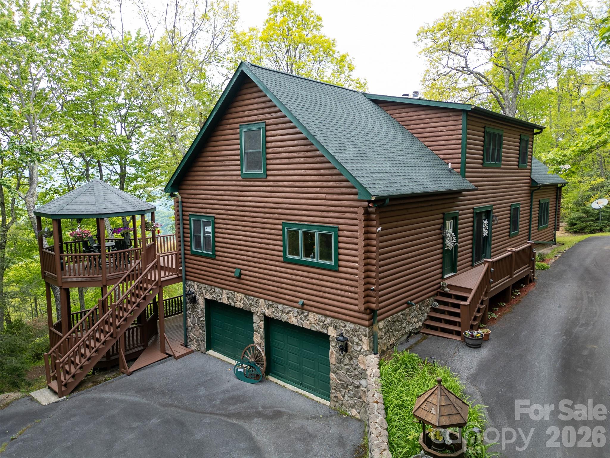 35 Falcon Crest Loop Maggie Valley, NC 28751 - Photo 44 of 46 a front view of a house with garden