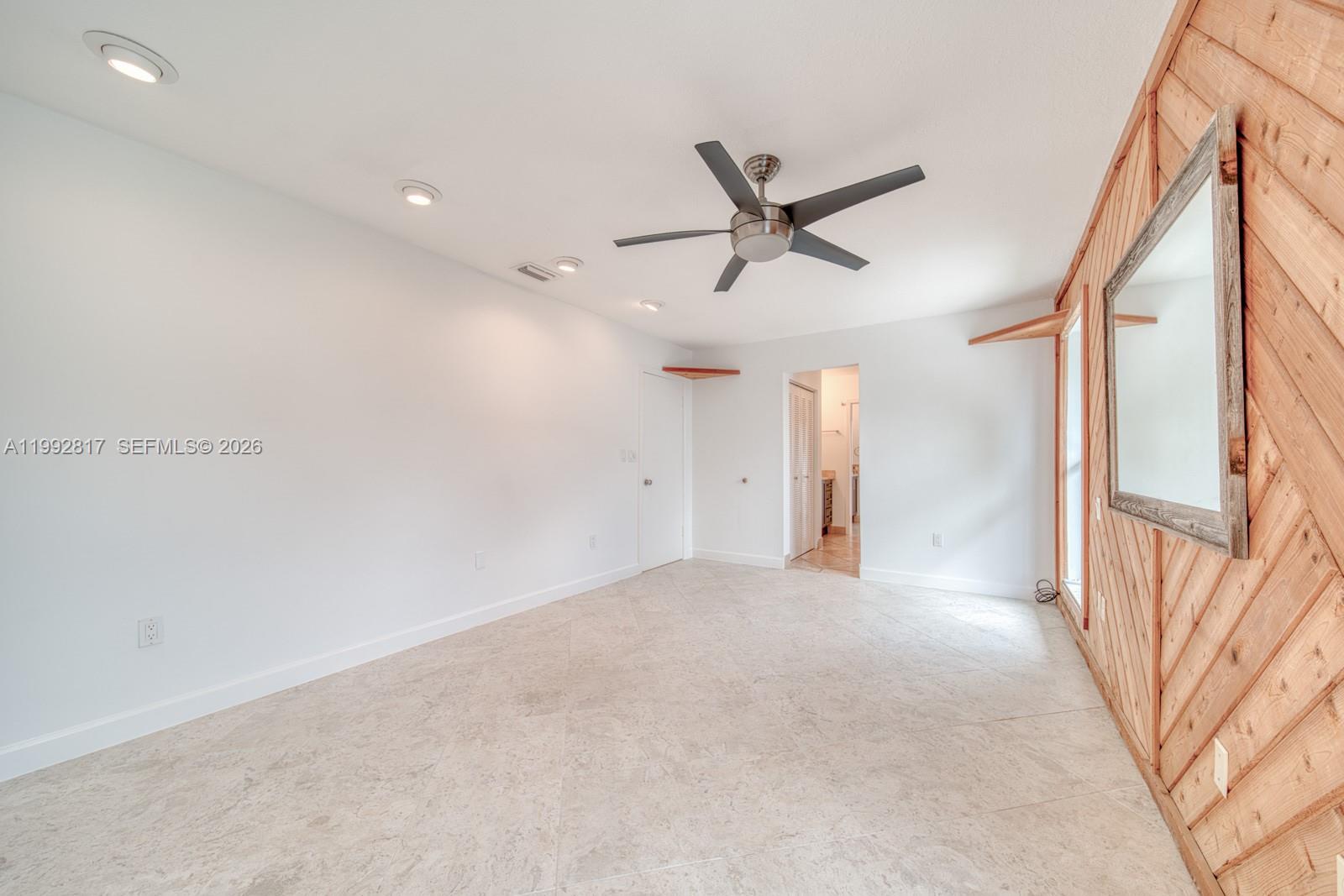 7320 Southwest 100th Court Miami, FL 33173 - Photo 14 of 36 a view of a livingroom with a ceiling fan and window